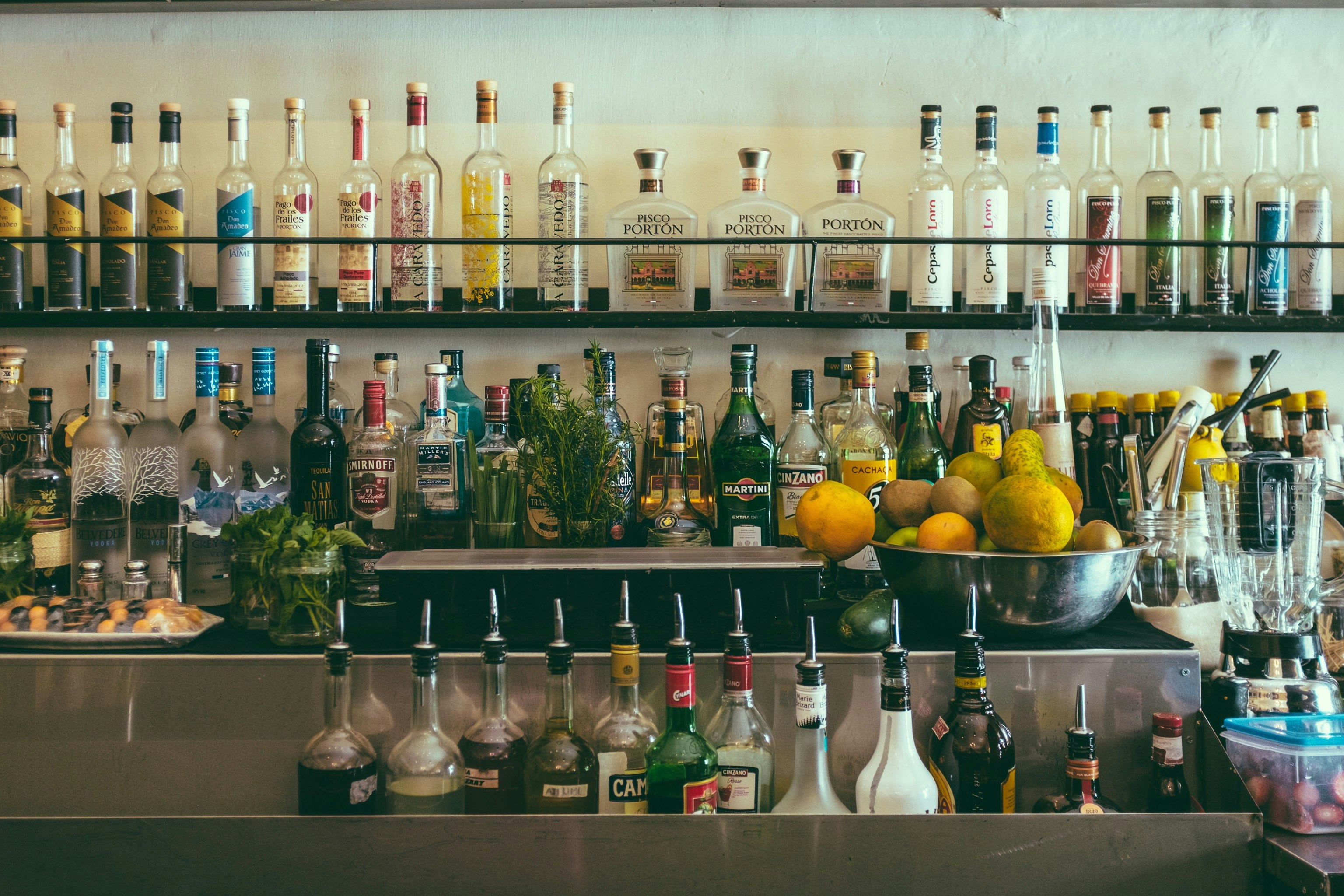 clear glass bottles on shelf